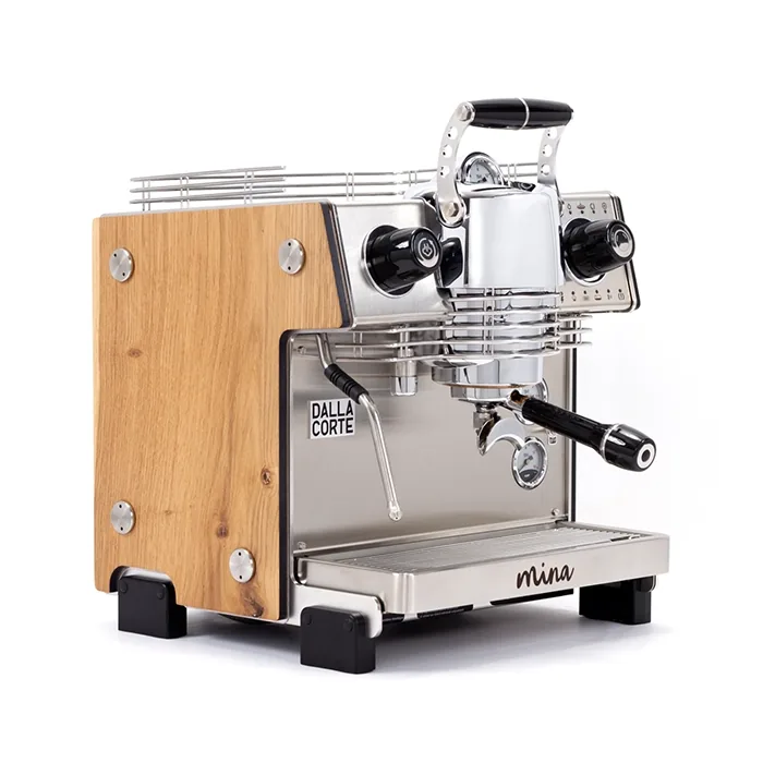 A sleek, Dalla Corte Mina Espresso Machine Wood, showcasing its distinctive manual lever (yoke) and modern design