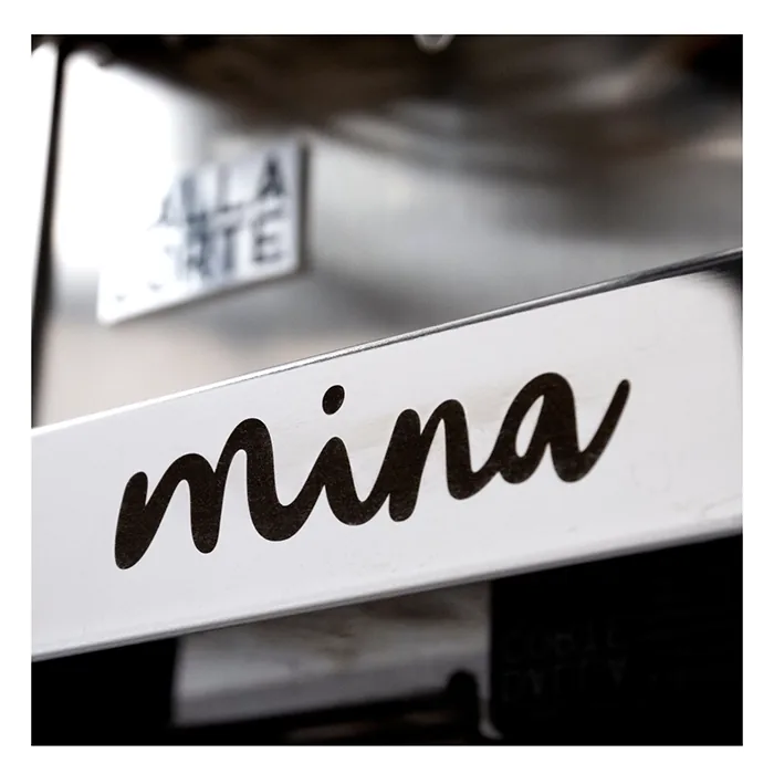 A smartphone screen showing the Dalla Corte Mina Espresso Machine Dark Oak App, with options for creating and saving flow profiles