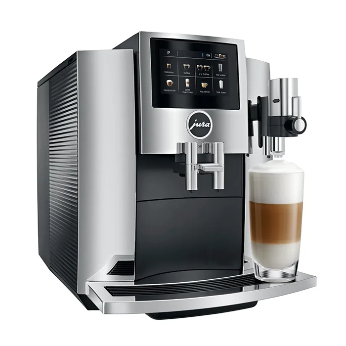 A sleek JURA S8 espresso machine chrome, displaying its large color touchscreen and a coffee cup ready for brewing