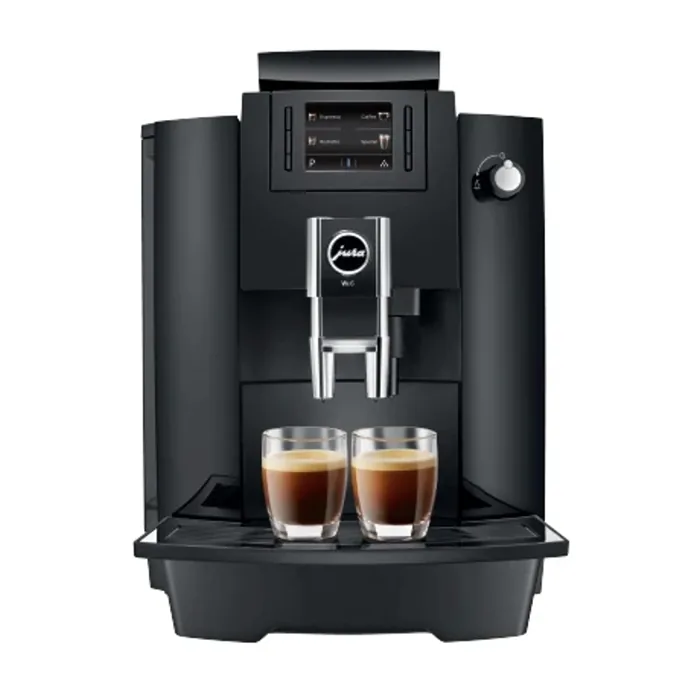 A sleek, black JURA WE6 coffee machine on a countertop, displaying its control panel