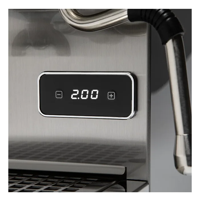 A sleek, Profitec GO Espresso Machine Stainless Steel on a countertop, showcasing its compact size and front panel controls