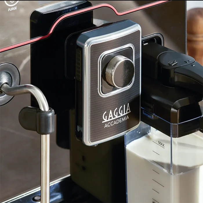 A detailed shot of the Gaggia Accademia's commercial steam wand articulating for milk frothing