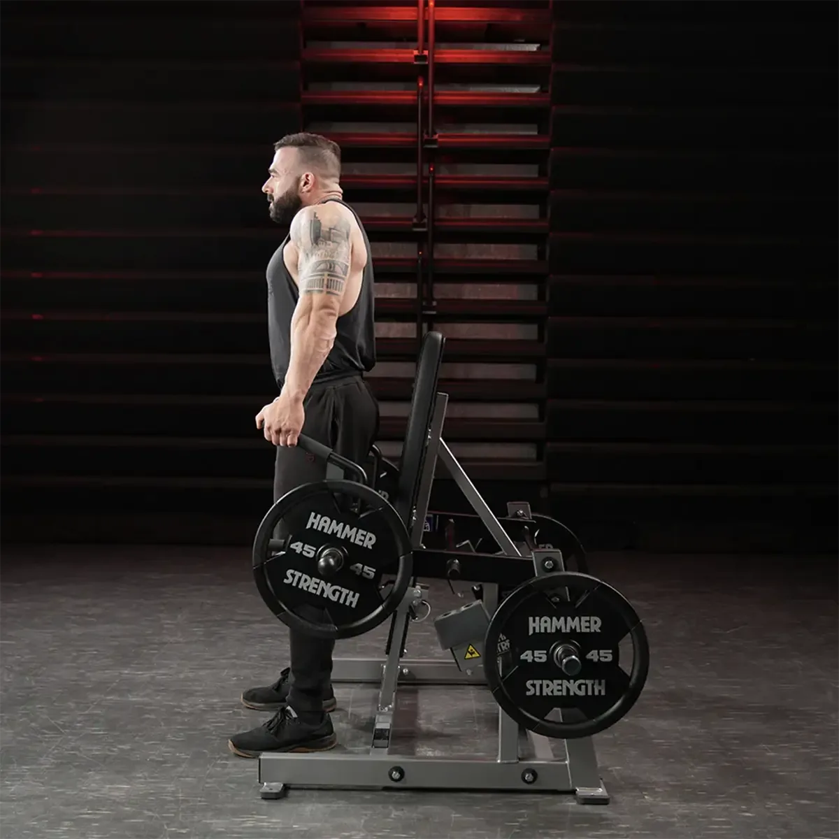 Hammer Strength Plate-loaded shrug machine with adjustable seat and side handles