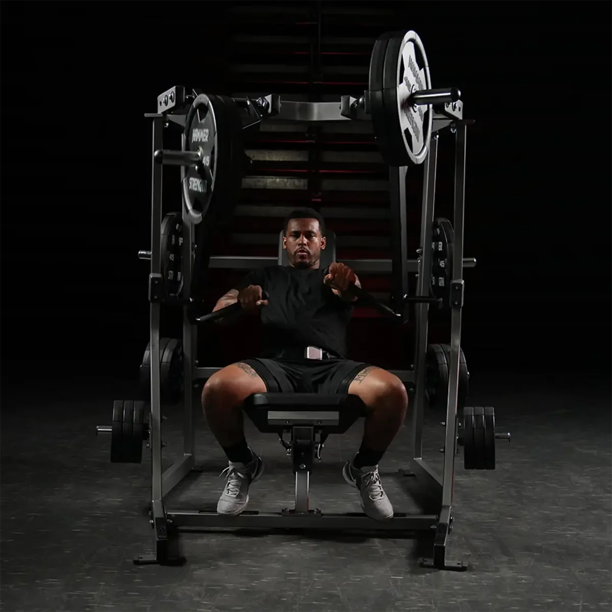 Hammer Strength Plate-loaded decline chest press with integrated weight storage rods