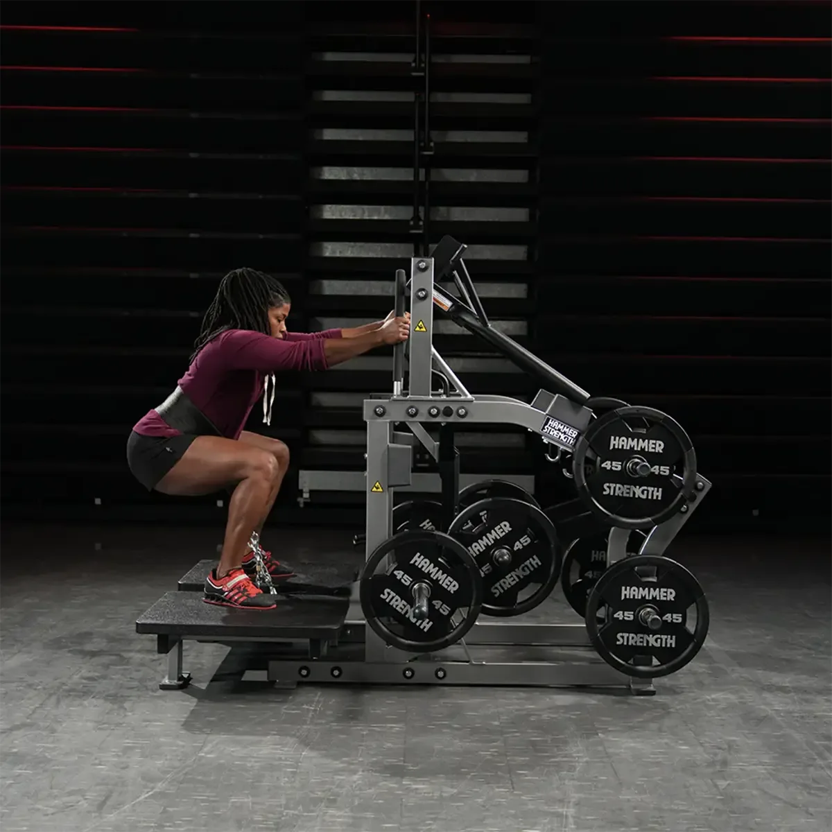 Hammer Strength Plate-loaded belt squat with band pegs and long handles