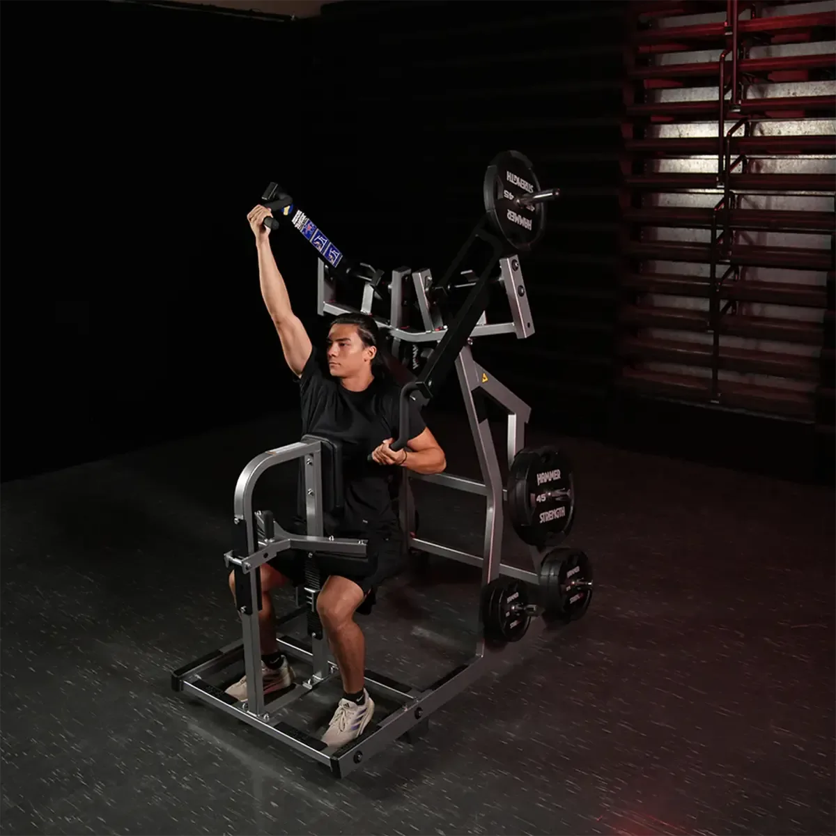 Hammer Strength back machine with adjustable seat and thigh hold pad