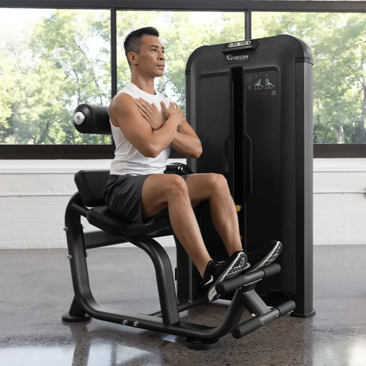 Vision Keystone Selectorized lower back machine with dual foot bars and instructional placards