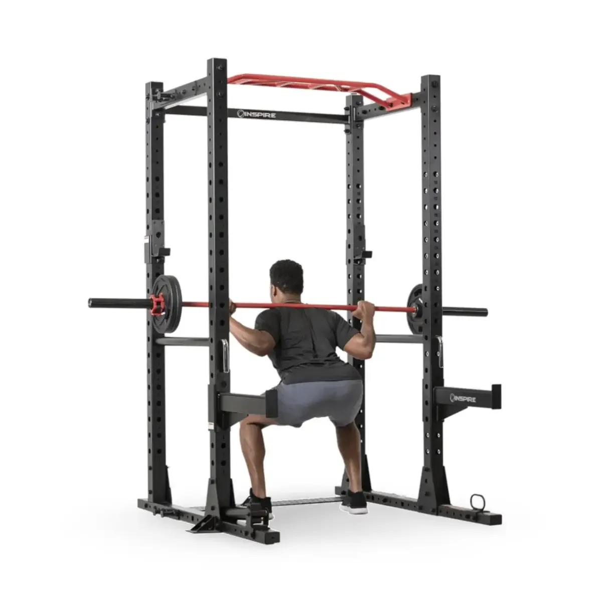 Inspire Fitness FPC1 Home gym strength rack with dip handles, safeties, and band attachments